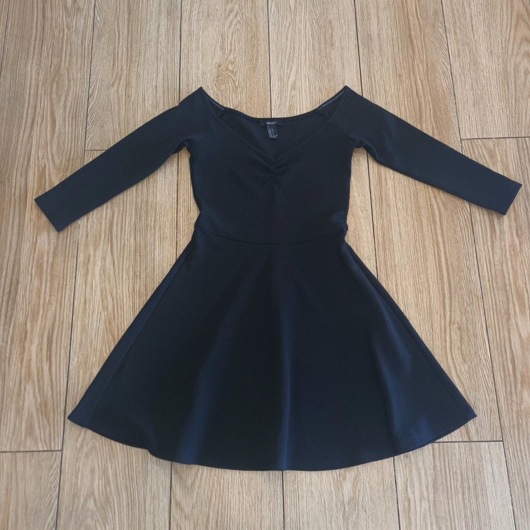 Forever 21 Black Off-Shoulder Dress (Category: Dresses) located in Makati City. Submitted by cdiana (Listing ID 1403665180, Image 2). Description: - Size: S/P - used once for an event - no when worn, actual Forever21 ad/model for reference - flaw: slight chipped anti-slip on the left side, see the last photo - Three-quarter length sleeves - Design: Fitted bodice with gathered bust, A-line skirt - Textured polyester fabric.