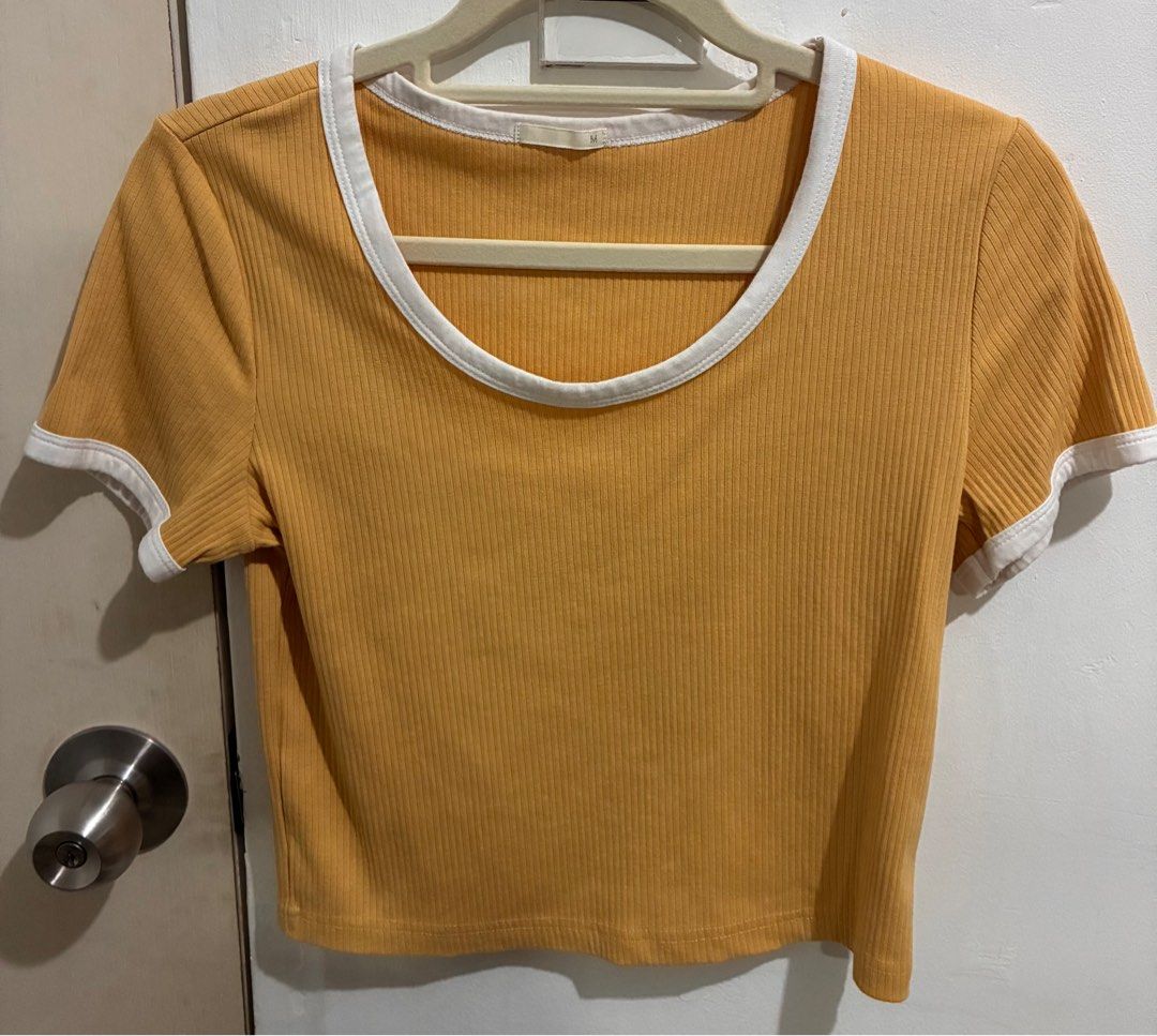 GU/Uniqlo semi cropped tee (Category: Blouses) located in San Fernando. Submitted by julieloops (Listing ID 1403704834, Image 1). Description: M on tag mustard actual color good as new, no flaws rfs: decluttering, moving abroad.