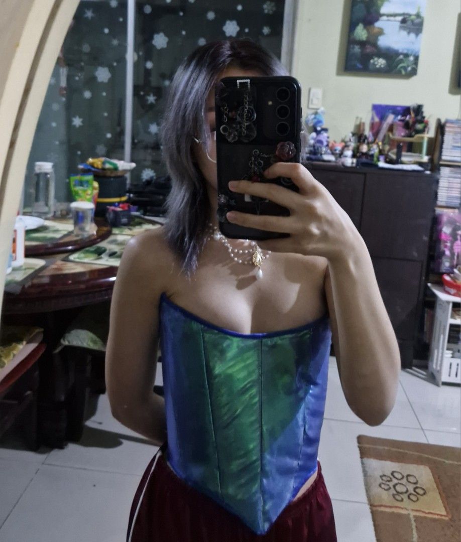 Iridescent Mermaid Blue Corset Top (Category: Others Tops) located in Manila. Submitted by jenina_ (Listing ID 1403789684, Image 3). Description: - Iridescent blue corset top - Unique color-shifting effect - Structured design with boning - Lace-up back - Vibrant blue with a hint of green - Includes ribbon for tying XS TO S Worn once for fitting RFS: Wrong design.