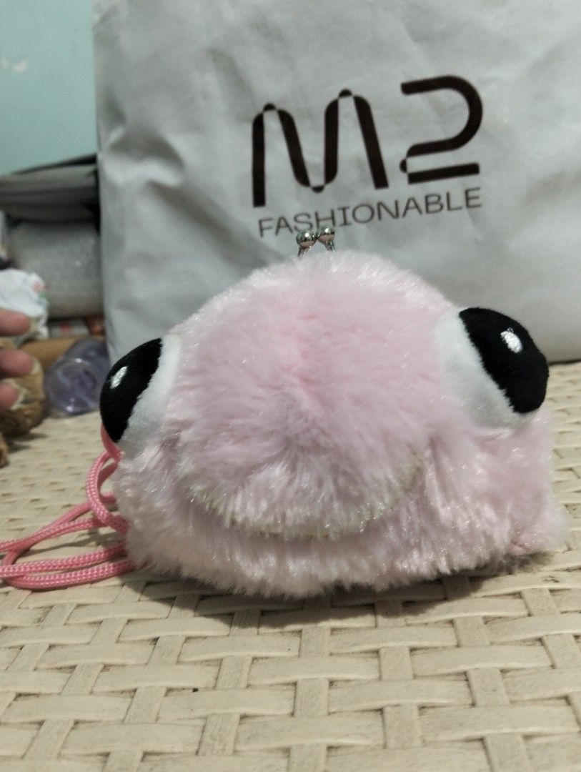 j.dream Shark Kisslock Bag (Category: Cross-body Bags) located in Gasan. Submitted by AngeliqueKaye (Listing ID 1403731570, Image 2). Description: Adorable J.Dream shark kisslock bag. Features a pink, fluffy exterior with large black eyes and a kisslock closure. Includes a pink strap for easy carrying. The bag has a pink interior and a cute tail design. Perfect for carrying small essentials. The bag has a small embroidered detail on the side..