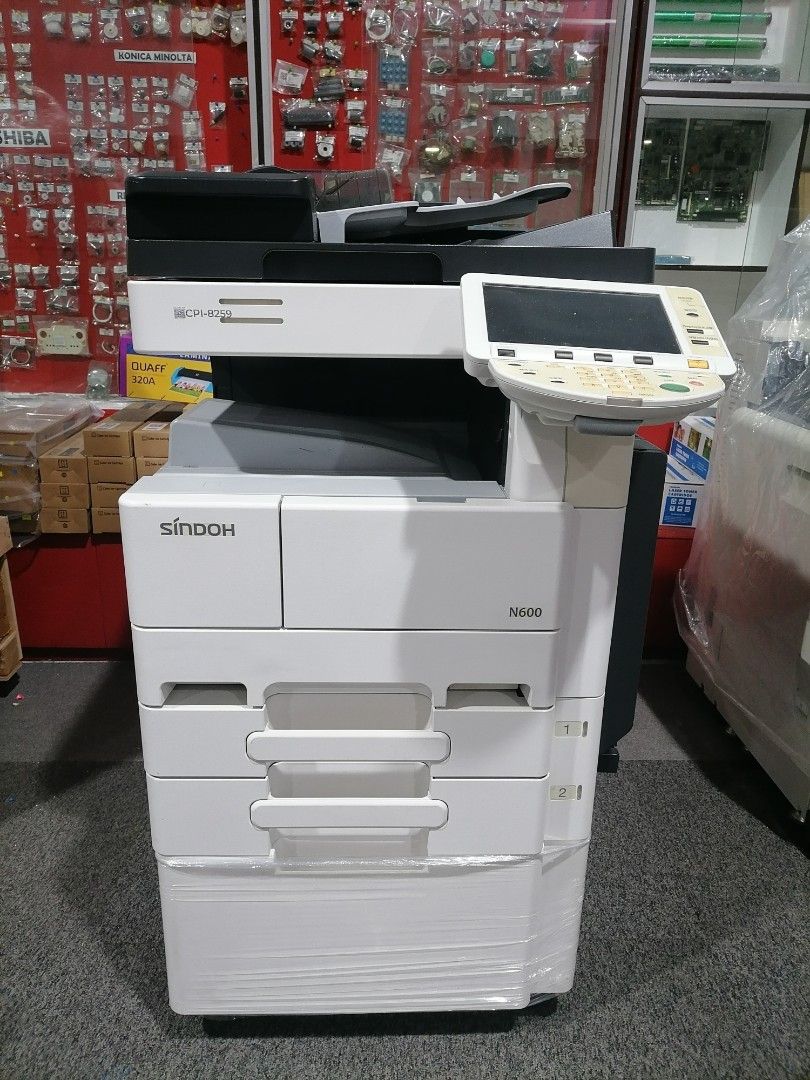 Konica Minolta Sindoh N600 Monochrome Printer (Category: Printers, Scanners & Copiers) located in Quezon City. Submitted by copieronlineinc (Listing ID 1403667037, Image 1). Description: Konica Minolta Sindoh N600 monochrome printer. Includes 3 reams of bond paper (long and short), 1 pack of toner (500g), a ring binding machine, a pack of plastic rings (50pcs), and a PVC cover sheet. Free delivery and a 1-year warranty are included. Promo runs un