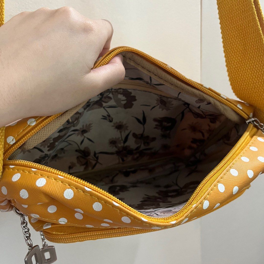 Mustard Yellow Polka Dot Shoulder Bag (Category: Shoulder Bags) located in Pasig City. Submitted by beabimbop (Listing ID 1403649061, Image 3). Description: 💛 Minor flaws (strap is a bit dirty, but it’s washable) 💛 Owned this for many years but rarely lang nagamit 💛 Price is negotiable 🏷️ Tags: shoulder bag, sling bag, polka dots, mustard bag, retro bag, kipling bag .