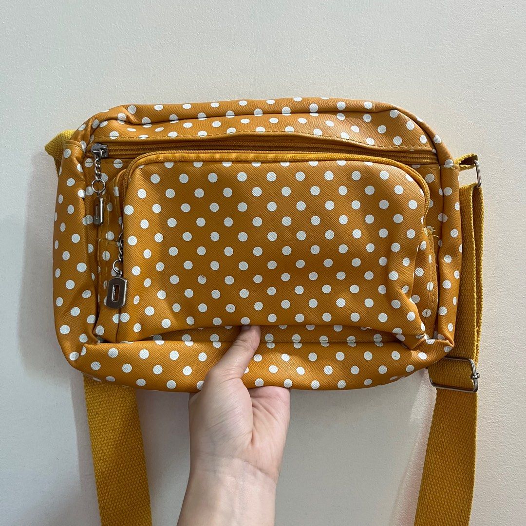 Mustard Yellow Polka Dot Shoulder Bag (Category: Shoulder Bags) located in Pasig City. Submitted by beabimbop (Listing ID 1403649061, Image 1). Description: 💛 Minor flaws (strap is a bit dirty, but it’s washable) 💛 Owned this for many years but rarely lang nagamit 💛 Price is negotiable 🏷️ Tags: shoulder bag, sling bag, polka dots, mustard bag, retro bag, kipling bag .