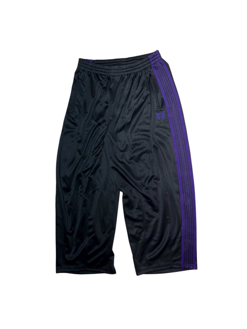 Needles Track Pants Black Purple (Category: Joggers) located in Manila. Submitted by ghostrideblurr (Listing ID 1403702455, Image 2). Description: - Black track pants - Purple side stripes - Zippered side pocket - Embroidered Needles butterfly logo - Cropped length - Elasticated waistband - Smooth, athletic fabric.
