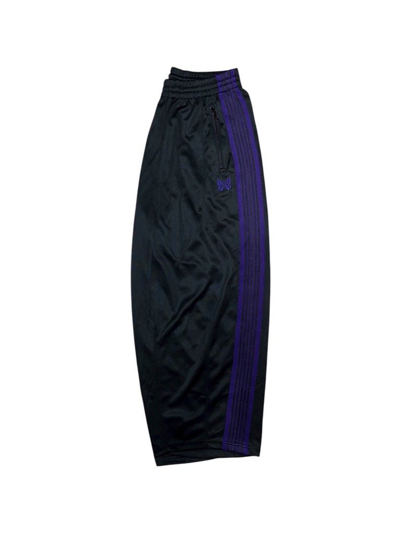 Needles Track Pants Black Purple (Category: Joggers) located in Manila. Submitted by ghostrideblurr (Listing ID 1403702455, Image 1). Description: - Black track pants - Purple side stripes - Zippered side pocket - Embroidered Needles butterfly logo - Cropped length - Elasticated waistband - Smooth, athletic fabric.