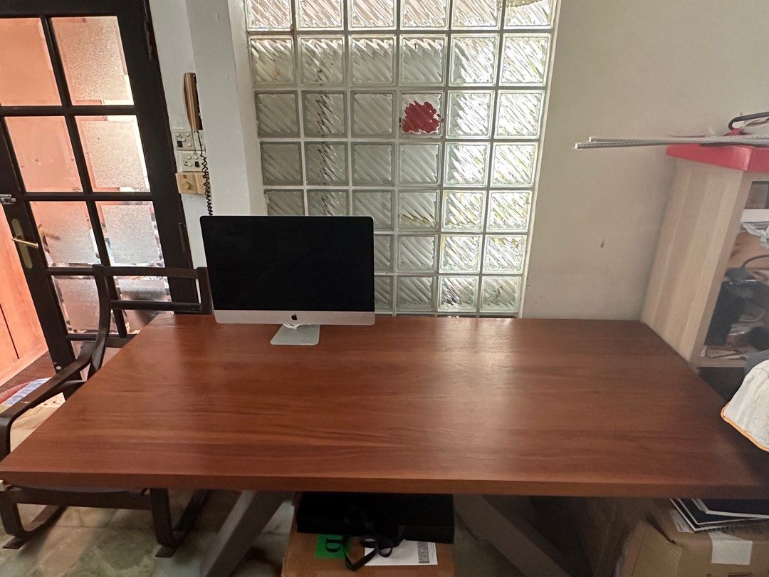 Solid Wood Dining Table (Category: Tables & Sets) located in Singapore. Submitted by tsm__ (Listing ID 1403667629, Image 1). Description: Beautiful solid wood dining table. Features a rich, warm wood tone and sturdy metal legs. Perfect for dining or as a large desk. 218cm length 98cm width 78cm height.