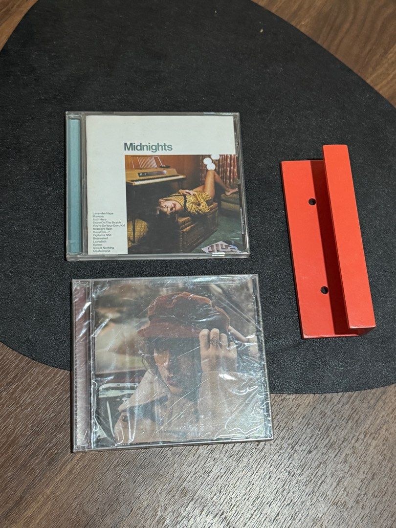 Taylor Swift Midnights & Red (Taylor’s Version) CD Album (Category: CDs & DVDs) located in Bocaue. Submitted by not_____archive (Listing ID 1403658013, Image 2). Description: Hello! FOR SALE! all are in very good condition, never been used or played RED Taylor’s Version (Sealed) - 950 Midnights Jade Green Edition (Unsealed) - 950 GET ALL WITH FREE STAND/WALL DISPLAY FOR 1800!! Purchased directly from taylor swift official store 😊.