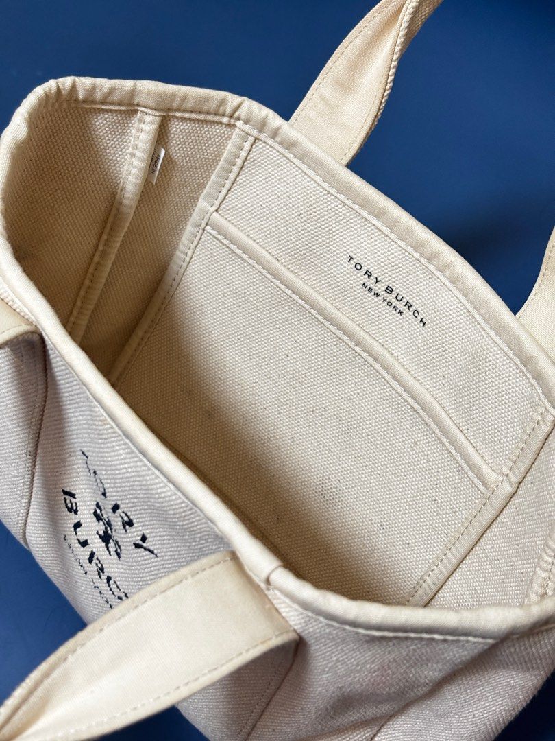 Tory Burch Canvas Mini Tote (Category: Luxury Bags & Wallets) located in Marikina City. Submitted by closetbycamille (Listing ID 1403709199, Image 3). Description: - Authentic Tory Burch mini tote bag - Canvas exterior with Tory Burch logo - Two top handles with leather accents - Interior pocket - Perfect for everyday use - Stylish and practical accessory.