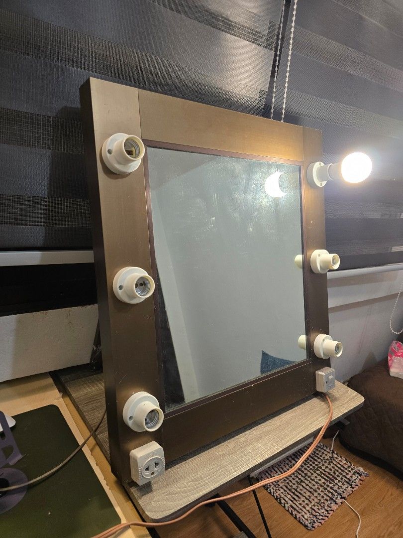 Vanity Mirror with Lights (Category: Mirrors) located in Pasig City. Submitted by kimjayson (Listing ID 1403796196, Image 1). Description: Heavy duty vanity mirror L 22 inches H 24 inches W 1.7 inches Like new. made of galvanized steel I think. with stand all bulb sockets working (bulb not included) light switch working (firefly brand) Outlet working (Omni brand) cord is 57 inches long RFS - Was gifted a big vanity table and mirror .