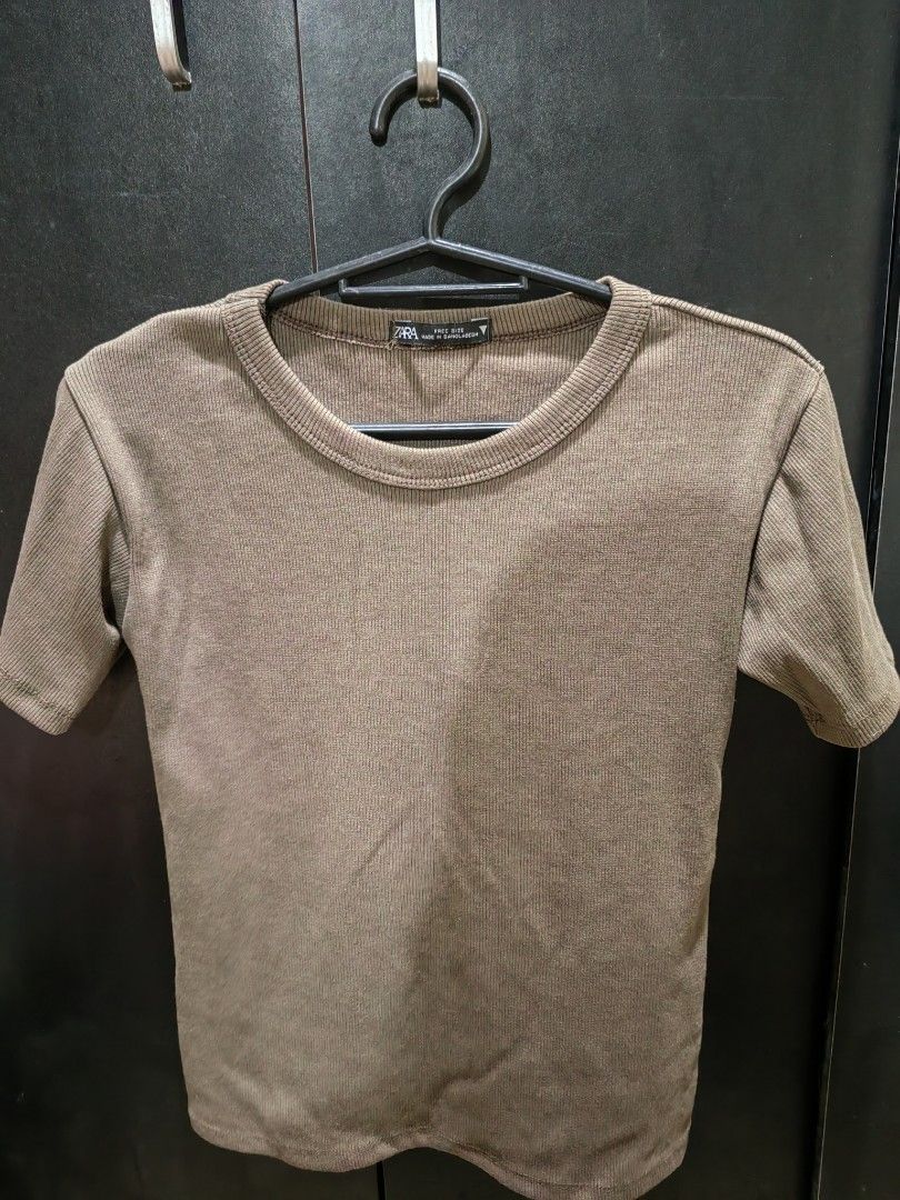 Zara Ribbed T-shirt - Free Size (Category: Shirts) located in Manila. Submitted by _thriftatbp (Listing ID 1403729803, Image 1). Description: Or get for FREE if u purchase minimum of 1k from my listings - Zara brown ribbed t-shirt - Free size - Short sleeves - Round neckline - Ribbed knit fabric - Made in Bangladesh.
