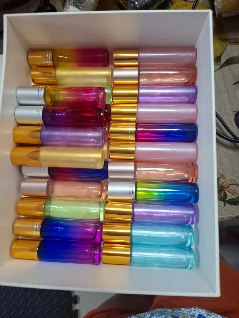 24 pcs Empty Oil/ Ointment Roll-ons with Gold or Silver Caps (Category: Everything Else Others) located in Pasay City. Submitted by pixia (Listing ID 1403826994, Image 1). Description: 24 pcs - Set of empty lipstick tubes - Gold-colored base - Clear or colored tubes - Colors include pink, purple, blue, and green - Ideal for DIY oil roll-ons - Perfect for refilling roll-on products.