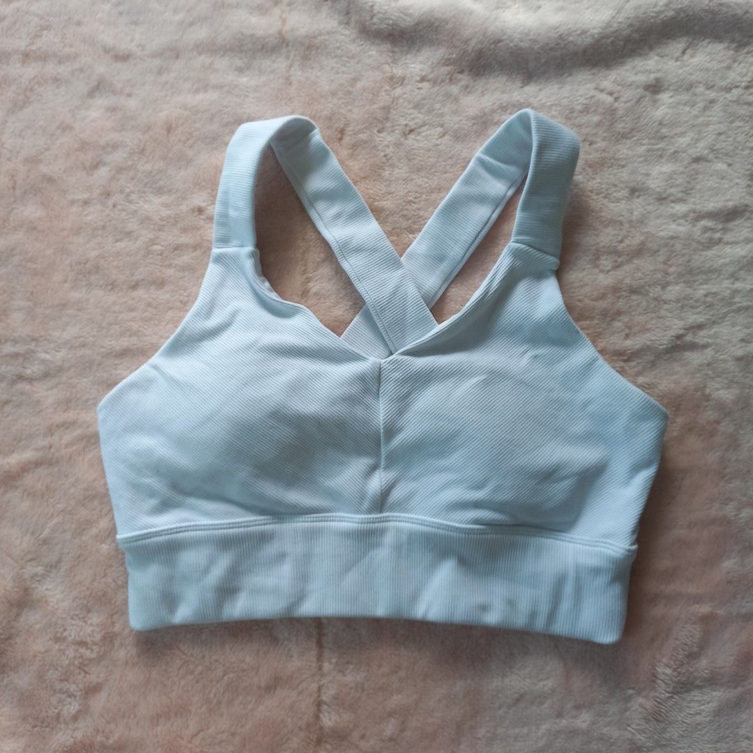 Alo Yoga White Sports Bra (Category: Activewear) located in Santiago. Submitted by lastlastprice (Listing ID 1403826273, Image 1). Description: - Alo Yoga sports bra - Light blue color - Size: L - Criss-cross back design - Ribbed fabric - Made in Vietnam - Features the Alo logo - Condition: Like new issue: need lng ng wash nadumihan sa loob.
