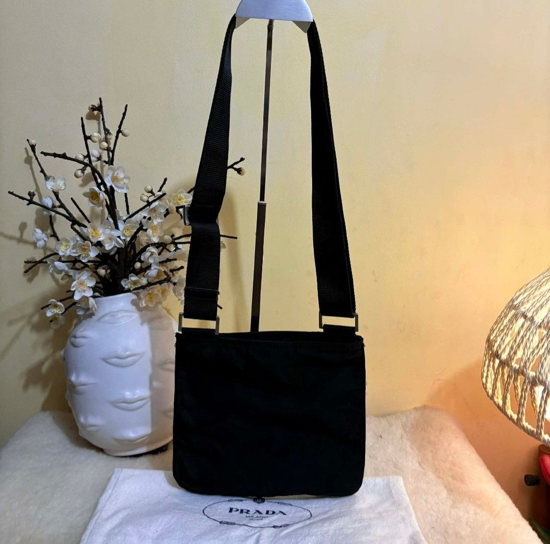 Authentic Rare Prada Tessuto Black Mini Sling Bag (Category: Luxury Bags & Wallets) located in Binangonan. Submitted by makoleksyon (Listing ID 1403916228, Image 2). Description: excellent condition like new no flaws comes with dust bag bought in Japan 100% authentic money back guarantee.