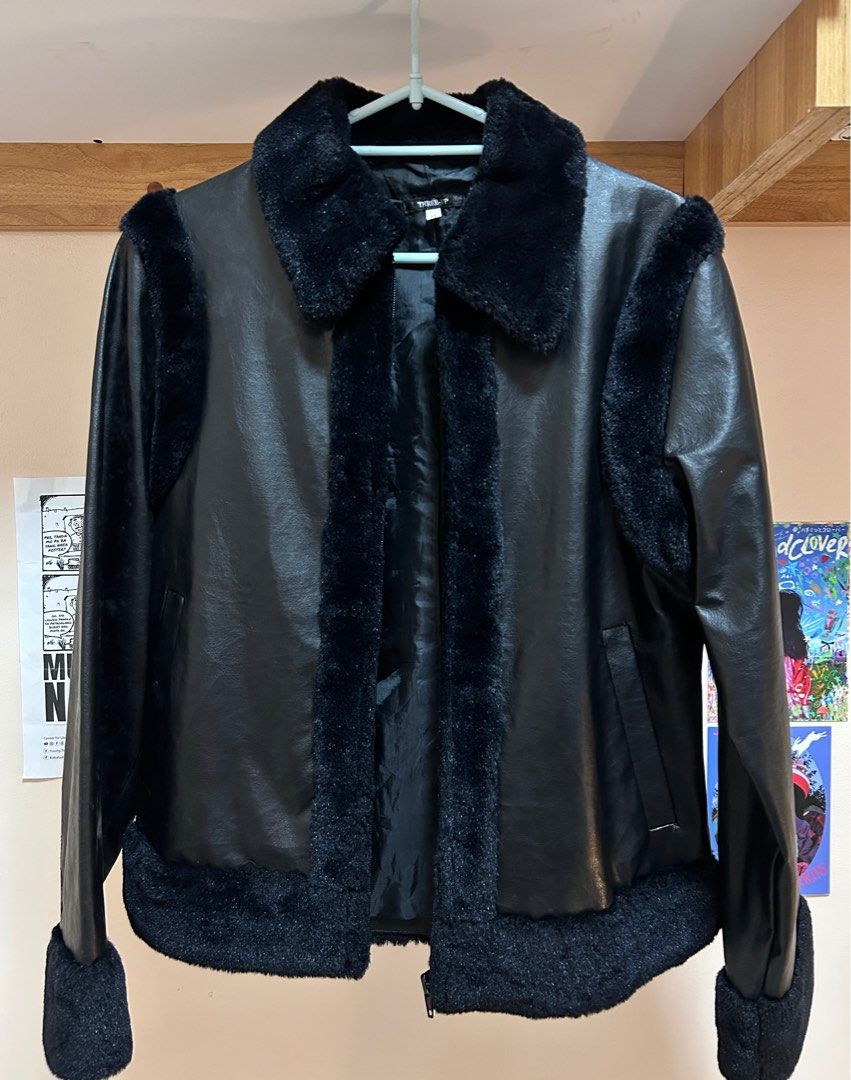 Black Faux Leather Jacket with Fur Trim (Category: Coats, Jackets and Outerwear) located in Pasig City. Submitted by feryclo (Listing ID 1403931921, Image 2). Description: - Black faux leather jacket - Fur trim detailing - Classic collar and cuffs with fur accents - Front zipper closure - Standard fit - Versatile for various occasions.