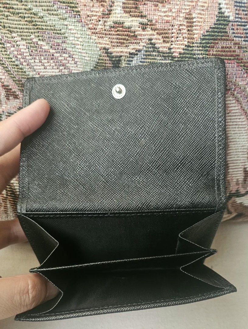 Burberry Checkered Wallet (Category: Luxury Bags & Wallets) located in Naga. Submitted by solamia (Listing ID 1403862798, Image 2). Description: - Authentic Burberry wallet - Iconic checkered pattern exterior - Black leather trim - Snap closure - Multiple card slots - Bill compartment - Black interior with embossed Burberry logo - Compact and functional design.