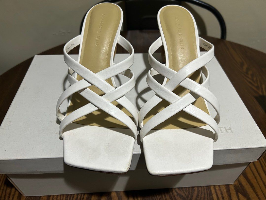 Charles & Keith White Heels US 6 / 36 (Category: Heels) located in Davao. Submitted by melchhhhh (Listing ID 1403964354, Image 2). Description: Sculptural-Heel Strappy Mules - White .
