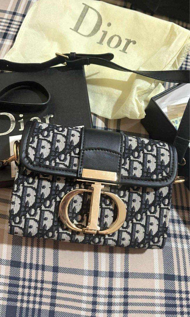 Dior Mini Sling Bag (Category: Luxury Bags & Wallets) located in Legazpi City. Submitted by closetbyandyyy (Listing ID 1403861400, Image 1). Description: topgrade!! very cute,, pm for when worn picture NEGOTIABLE FOR SURE BUYER.
