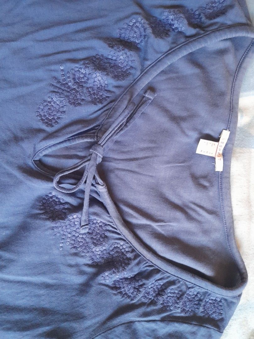 Esprit Embroidered blouse (Category: Blouses) located in San Pedro. Submitted by JohnsonKeeps (Listing ID 1403843797, Image 2). Description: - Esprit blouse - Blue color - V-neck with tie detail - Delicate embroidery around neckline - Size M - flaws, small hole at the front bottom (see picture).