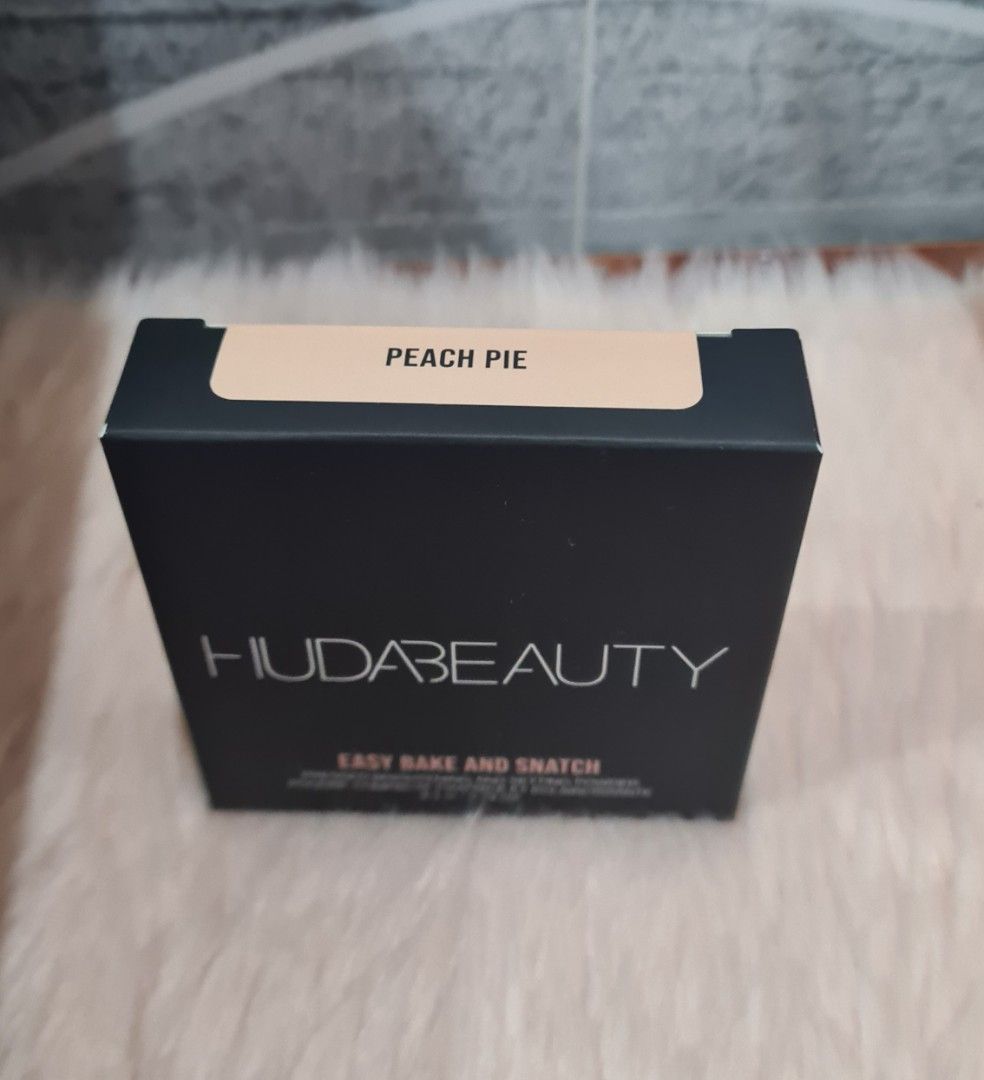 Huda Beauty Easy Bake Pressed Powder - Peach Pie (Category: Makeup) located in Lumban. Submitted by xtnsale (Listing ID 1403981429, Image 3). Description: Huda Beauty Easy Bake Pressed Powder in Peach Pie. This powder provides an all-day wear and filter finish. It is talc and fragrance-free. The box contains 8.5g / 0.29 oz of product..