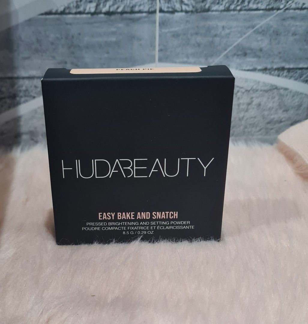 Huda Beauty Easy Bake Pressed Powder - Peach Pie (Category: Makeup) located in Lumban. Submitted by xtnsale (Listing ID 1403981429, Image 1). Description: Huda Beauty Easy Bake Pressed Powder in Peach Pie. This powder provides an all-day wear and filter finish. It is talc and fragrance-free. The box contains 8.5g / 0.29 oz of product..