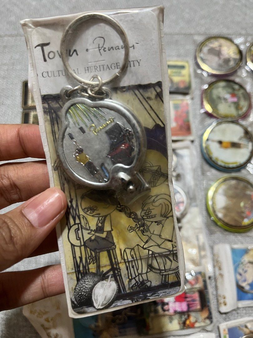 keychains (Category: Other Merchandise) located in Singapore. Submitted by myraa_ms (Listing ID 1403838771, Image 3). Description: - assorted keychains from Malaysia, Penang - 1 for $1, take all 30 pcs for $18 - has keychains, nail clippers and fridge magnets.