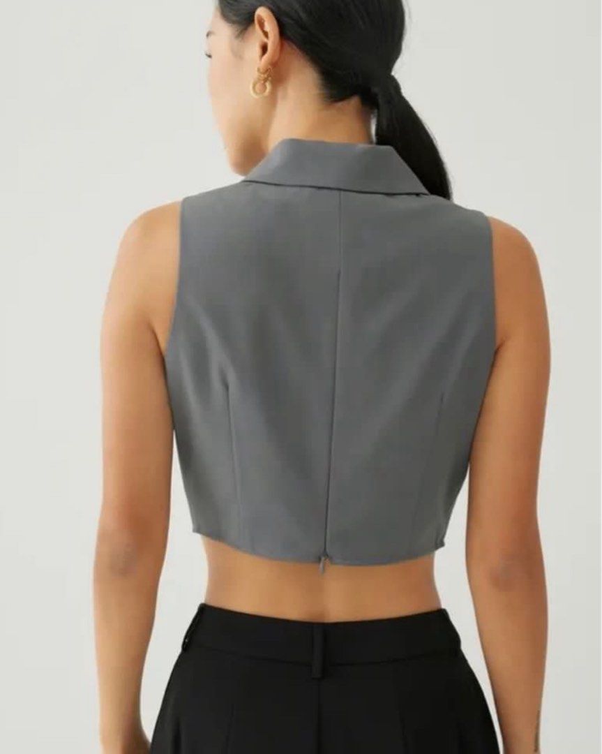 Love, Bonito Sleeveless Blazer Top (Category: Sleeveless) located in Makati City. Submitted by secondavenue_ (Listing ID 1403869074, Image 2). Description: - Love, Bonito sleeveless blazer top - Gray color - Cropped design - Notched lapel - Back zipper closure - Size tag visible in photos - Dress up or down - Never used, just washed it only! .
