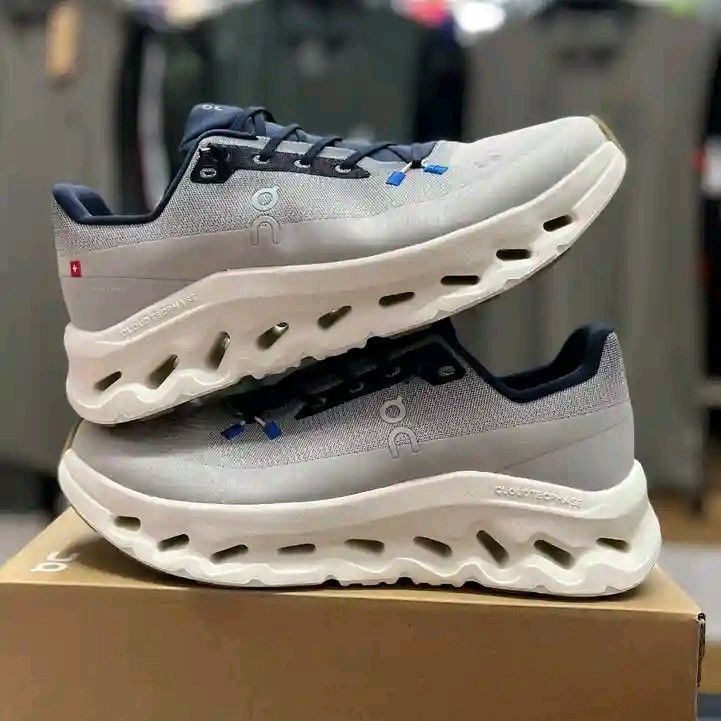 On CloudTec Sneakers (Category: Sneakers) located in Makati City. Submitted by wander-kicks (Listing ID 1403818440, Image 1). Description: - On CloudTec sneakers - Unique design with breathable upper - Neutral color scheme with blue accents - CloudTec technology for cushioning and support.