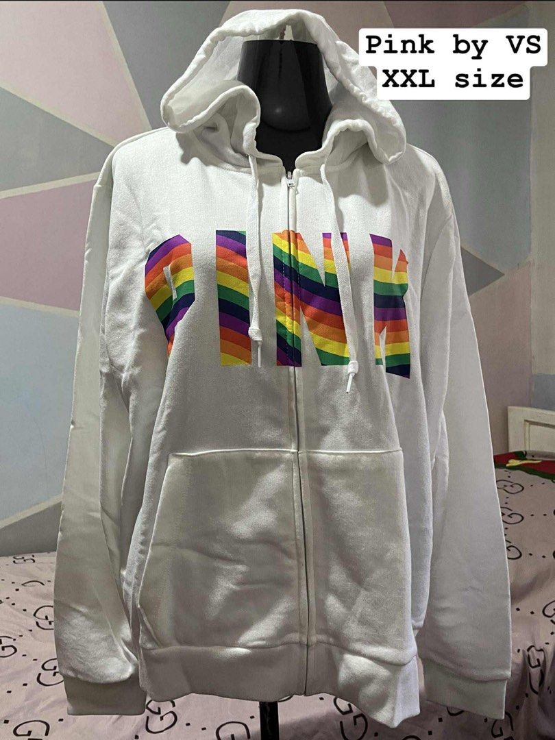 Pink by VS XXL Hoodie (Category: Coats, Jackets and Outerwear) located in Antipolo. Submitted by lisyel (Listing ID 1403846677, Image 1). Description: - Pink by Victoria's Secret hoodie - White color - Full zip closure - Features a hood - Rainbow "PINK" print on the front - Two front pockets - Size: XXL.