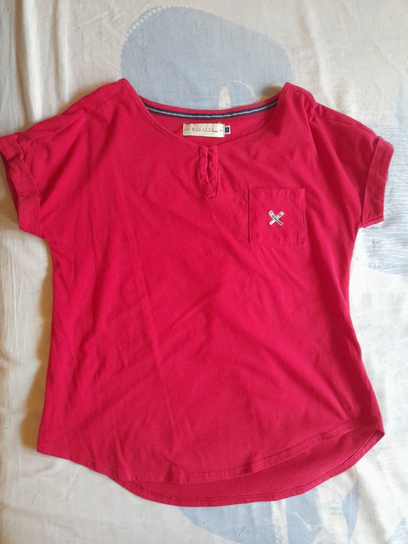Regatta Red blouse with Pocket (Category: Blouses) located in San Pedro. Submitted by JohnsonKeeps (Listing ID 1403867547, Image 1). Description: - Red Regatta blouse shirt - Features a small front pocket with logo - Henley neckline - Medium size Chest width = 17 inches (laid flat) Cuff = 11 inches Armpit = 6.5 inches (laid flat) - Short sleeves - Material: Cotton/Polyester blend.