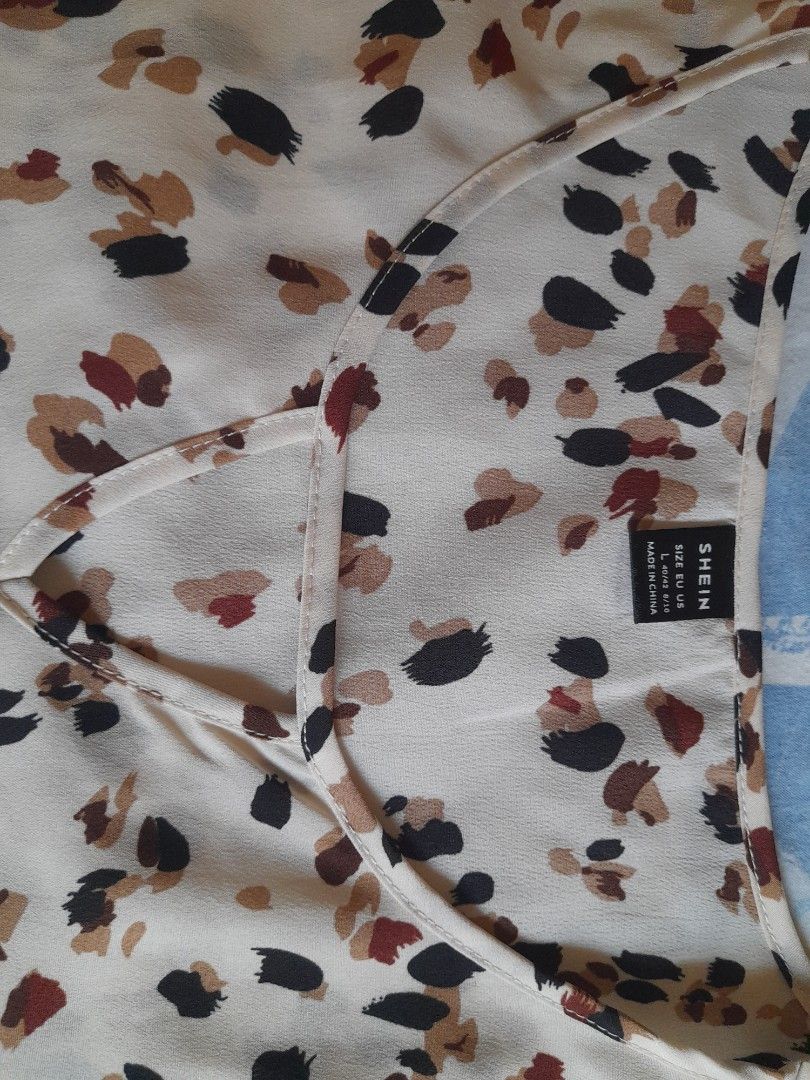 SHEIN Leopard Print Blouse - Size L (Category: Blouses) located in San Pedro. Submitted by JohnsonKeeps (Listing ID 1403840512, Image 2). Description: Shein blouse Lightweight material Apricot color with brown and black prints.