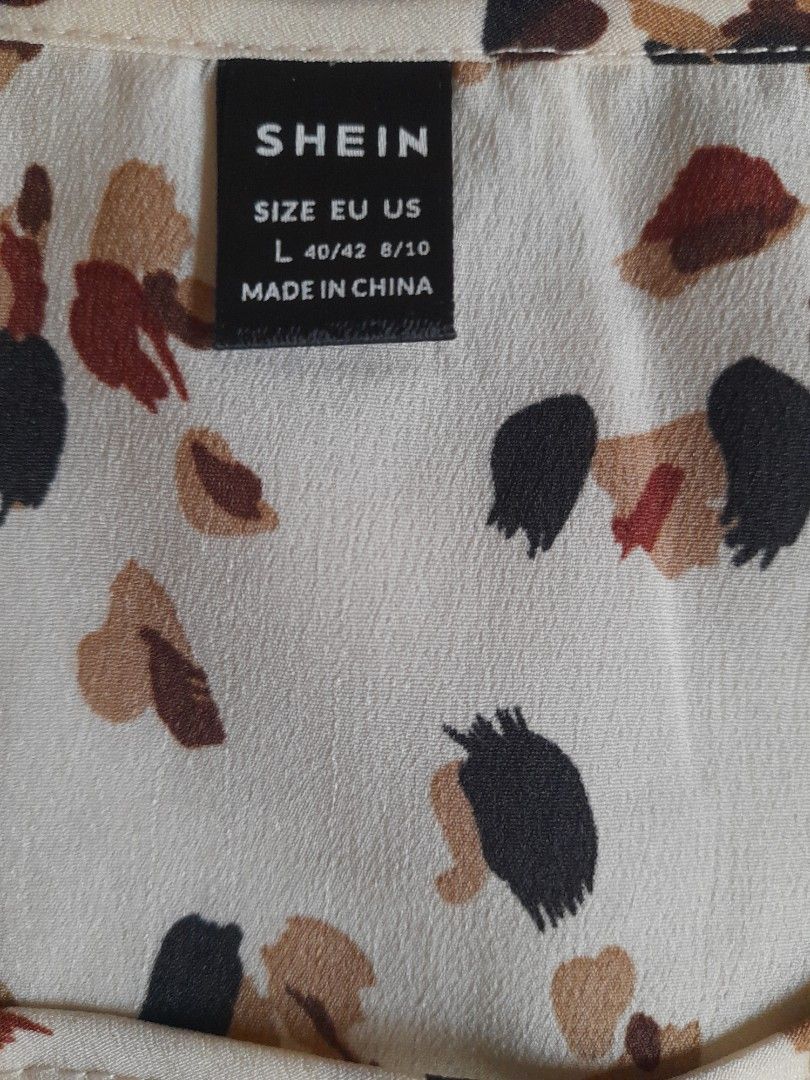 SHEIN Leopard Print Blouse - Size L (Category: Blouses) located in San Pedro. Submitted by JohnsonKeeps (Listing ID 1403840512, Image 3). Description: Shein blouse Lightweight material Apricot color with brown and black prints.