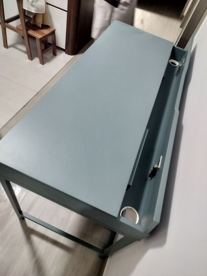 Study Table (Category: Tables & Sets) located in Singapore. Submitted by ashthekey (Listing ID 1403903604, Image 3). Description: IKEA blue study table in decent condition. Rarely used and relatively new. There are a few small scratches but they're not that visible. bought at $229. 132x58cm payment using paylah/paynow preferably.