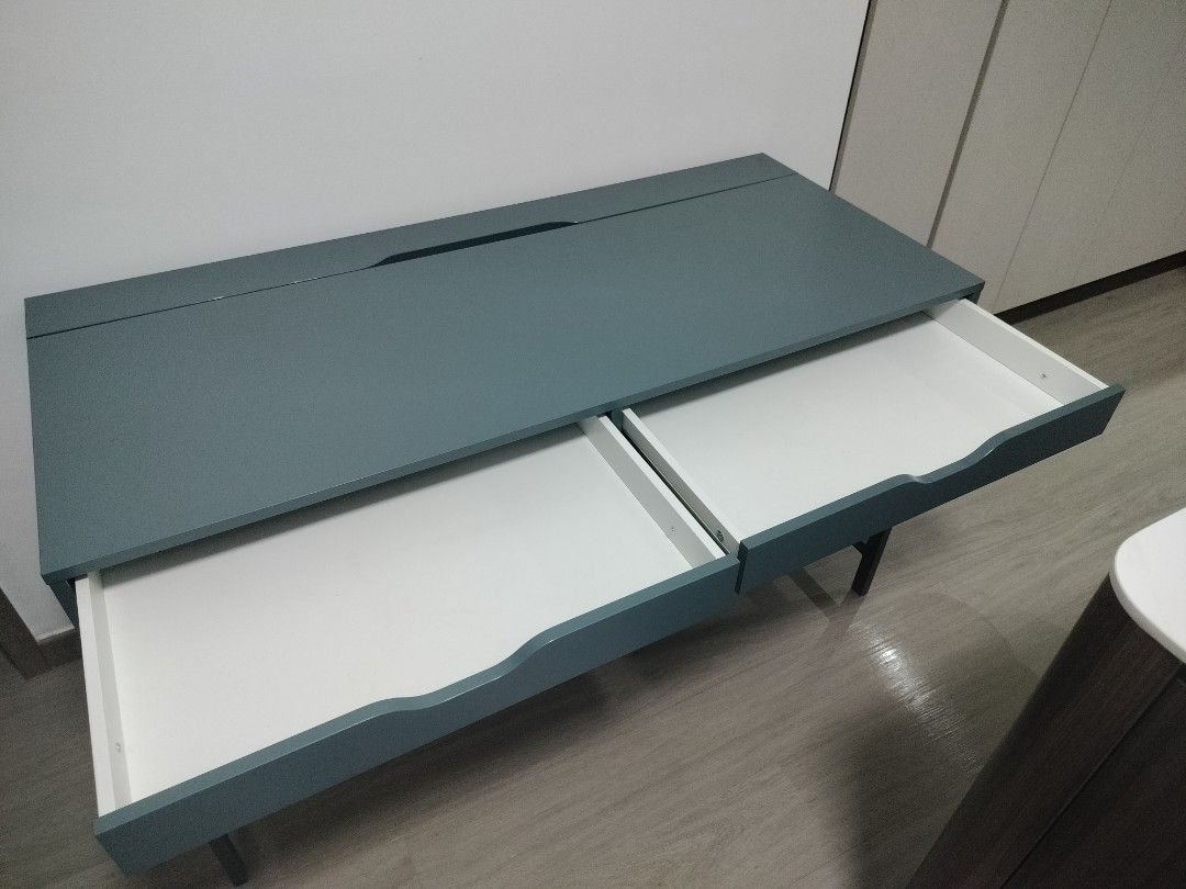 Study Table (Category: Tables & Sets) located in Singapore. Submitted by ashthekey (Listing ID 1403903604, Image 2). Description: IKEA blue study table in decent condition. Rarely used and relatively new. There are a few small scratches but they're not that visible. bought at $229. 132x58cm payment using paylah/paynow preferably.