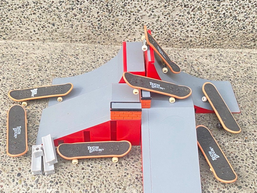 Tech Deck Fingerboard Ramp Set (Category: Action & Battle Toys) located in Manila. Submitted by 3asonlineshop (Listing ID 1403858199, Image 1). Description: - Tech Deck fingerboard set - Features a gray and red ramp with multiple levels and obstacles - Includes several fingerboards with the Tech Deck logo - Also includes small gray pieces - Great for fingerboard enthusiasts!.