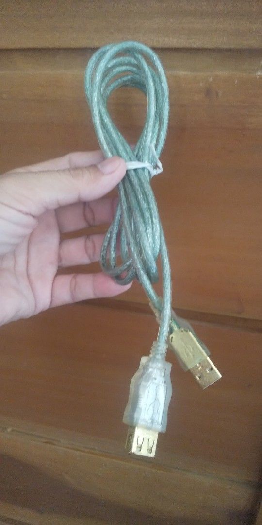 USB Extention (2 meters) (Category: Chargers & Cables) located in Carmona. Submitted by rpute (Listing ID 1403956923, Image 1). Description: - Transparent plastic covering on female end - Light green cable color - Gold-colored connectors .