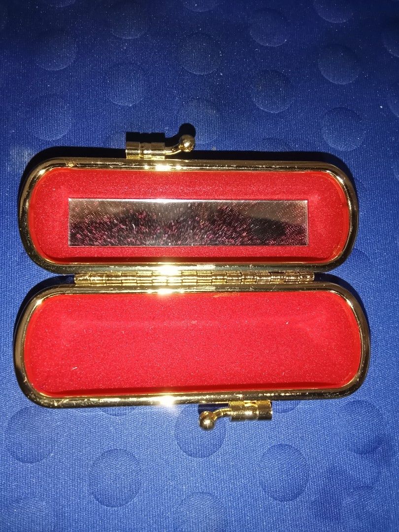 Vintage Lipstick Case with Mirror (Category: Makeup) located in Bocaue. Submitted by marajapansurplus (Listing ID 1403913685, Image 2). Description: - Vintage floral case - Gold-colored frame and clasp - Red fabric lining - Includes a small mirror - Ideal for small items - Stylish and functional.