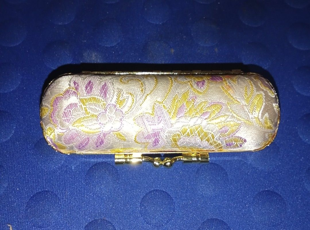Vintage Lipstick Case with Mirror (Category: Makeup) located in Bocaue. Submitted by marajapansurplus (Listing ID 1403913685, Image 1). Description: - Vintage floral case - Gold-colored frame and clasp - Red fabric lining - Includes a small mirror - Ideal for small items - Stylish and functional.