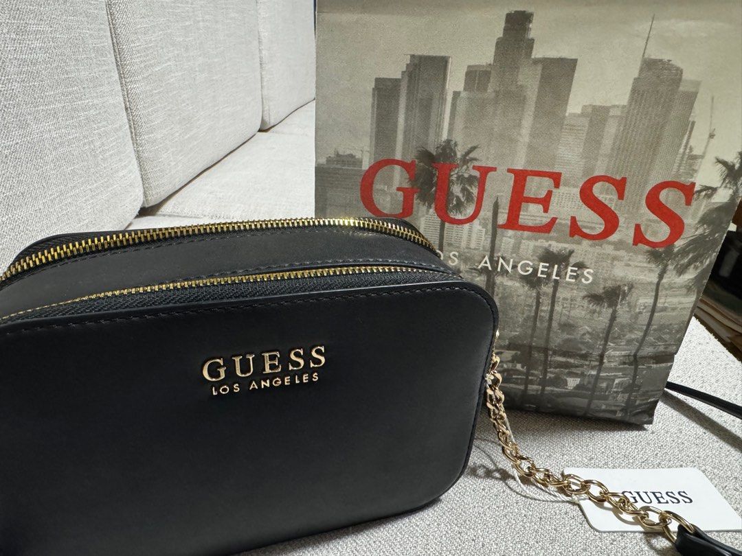 Authentic Black Guess Crossbody Bag with Tag (Category: Cross-body Bags) located in San Mateo. Submitted by clairaaa (Listing ID 1404139000, Image 1). Description: Authentic Guess crossbody bag still with paperbag and tag Location: San Mateo, Rizal RFS: decluttering, it was a gift, never been used.