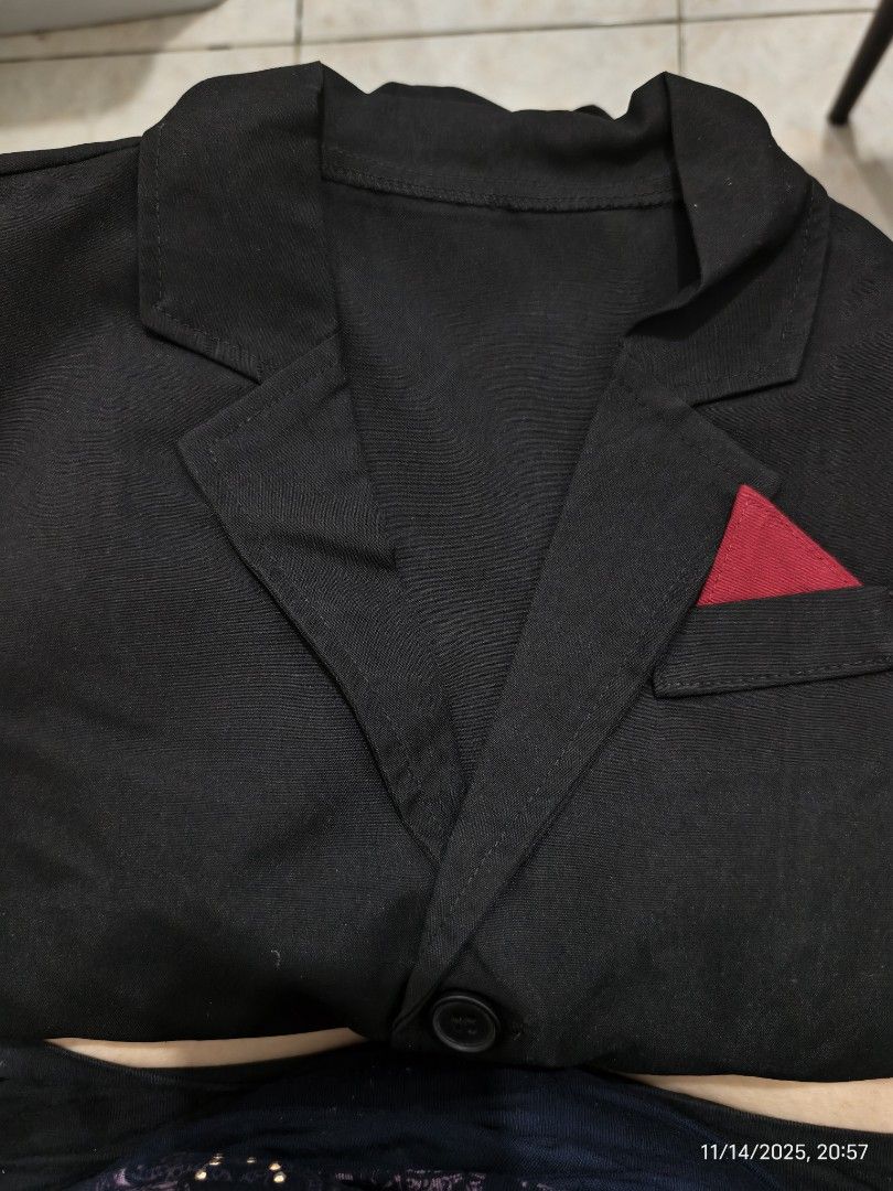 Black Blazer with Red Pocket Detail (Category: Babies & Kids Fashion) located in Quezon City. Submitted by trustedmom (Listing ID 1404122389, Image 2). Description: - Black blazer - Single button closure - Red triangle pocket detail - Two front pockets - Sturdy fabric - Folded condition (likely new or lightly used).