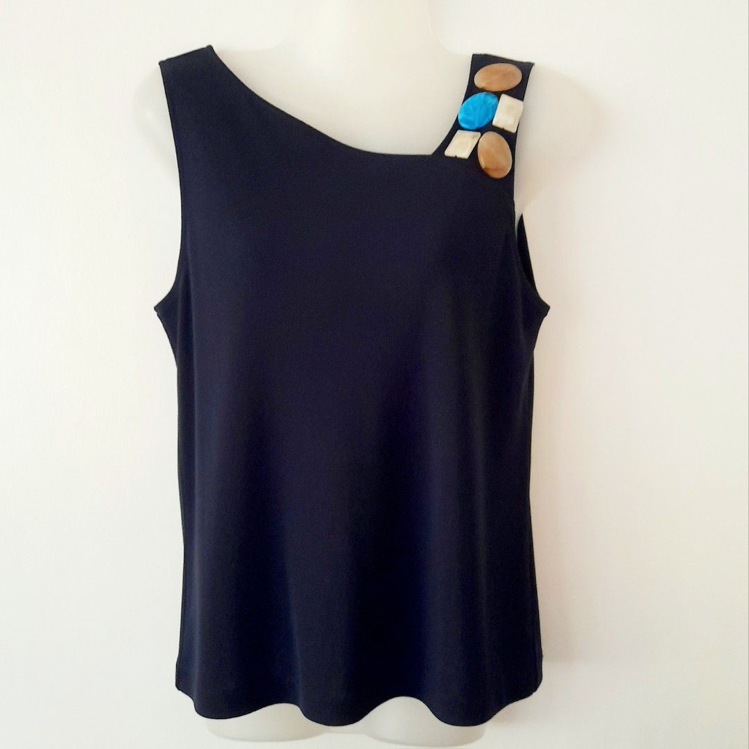 DKNY Embellished Asymmetrical Sleeveless Top (Category: Sleeveless) located in Quezon City. Submitted by lovedlux (Listing ID 1404099917, Image 2). Description: Accentuate a shoulder! Worn with blazer for work, without for happy hour. Navy blue, size M No flaws Flatlay Measurements: Chest - 16in Length - 23in .