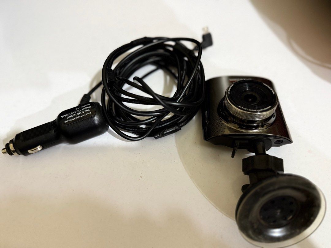 DUB A3 Dash Cam (Category: Cameras) located in Quezon City. Submitted by marcelm.921 (Listing ID 1404094791, Image 3). Description: DUB Project A3 dash cam with a 2.4" screen and 140-degree wide-angle lens. It records in Full HD 1080p using a Sony IMX322 sensor. Features include loop recording, G-sensor, and enhanced night vision. Includes the dash cam unit, car charger, and mounting bracket..