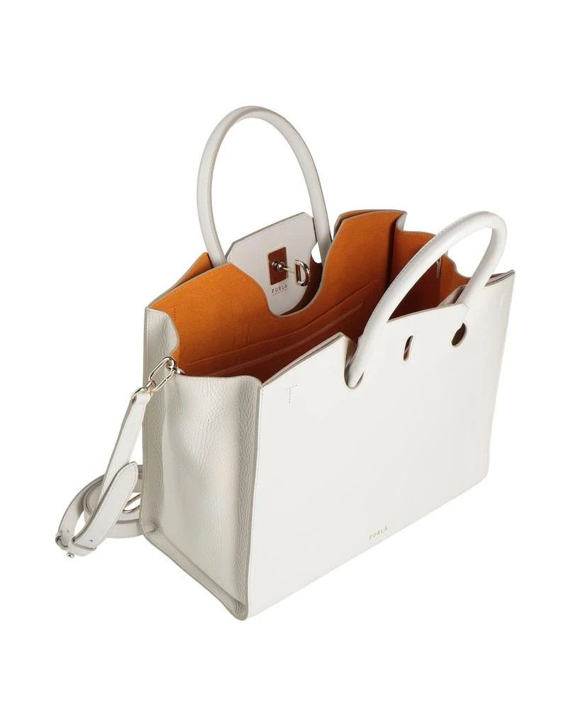 Furla Genesi Off White Handbag (Category: Luxury Bags & Wallets) located in Imus. Submitted by abckidss (Listing ID 1404089389, Image 3). Description: COMPOSITION 100% Calfskin MEASUREMENTS Handle drop 10 cm, Depth 15 cm, Height 25 cm, Length of handle 39 cm, Width 39 cm DETAILS tote, leather, solid color, brand logo, framed closure, leather lining, internal pockets, double handle, detachable shoulder strap, feet at base, large size, contains non