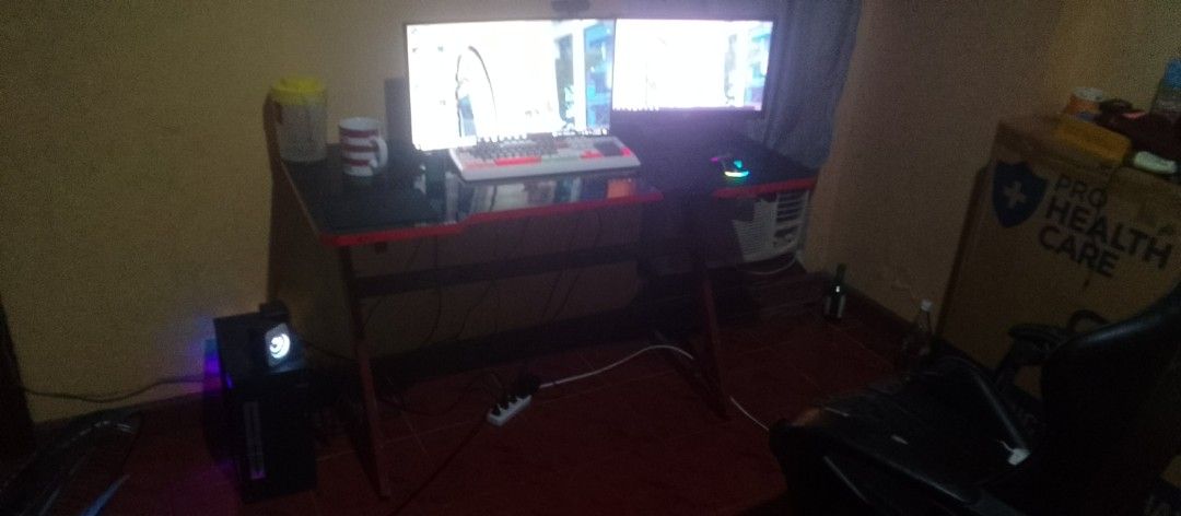 Gaming PC Setup with Dual Monitors (Category: Desktops) located in Santa Cruz, Pampanga. Submitted by juliajalan05857 (Listing ID 1404012270, Image 3). Description: specs take all PC Tower AMD A8-7680 (Radeon R7), 16 GB RAM, Windows 10 Pro — older gen but still good for office/school/light gaming 1tb ssd ramsta 1tb hdd Monitor 1 (AOC) 22″–24″, 1080p Monitor 2 (ViewPoint) similar size/spec Gaming Table mid-size, red-black edges, good condition RGB