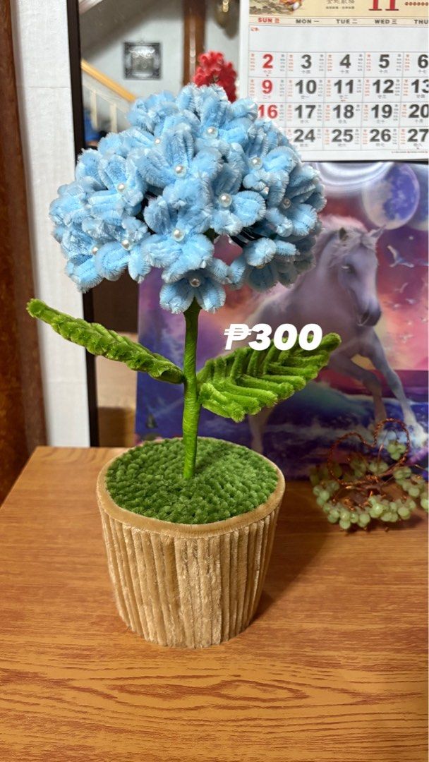 Handmade Blue Hydrangea Flower (Category: Flowers & Bouquets) located in Cavite. Submitted by marissa0_0 (Listing ID 1404157365, Image 1). Description: - Handmade blue hydrangea flower. - Features a soft, fuzzy texture. - Adorned with delicate pearl accents. - Designed for home decor or gifting. - In excellent condition..