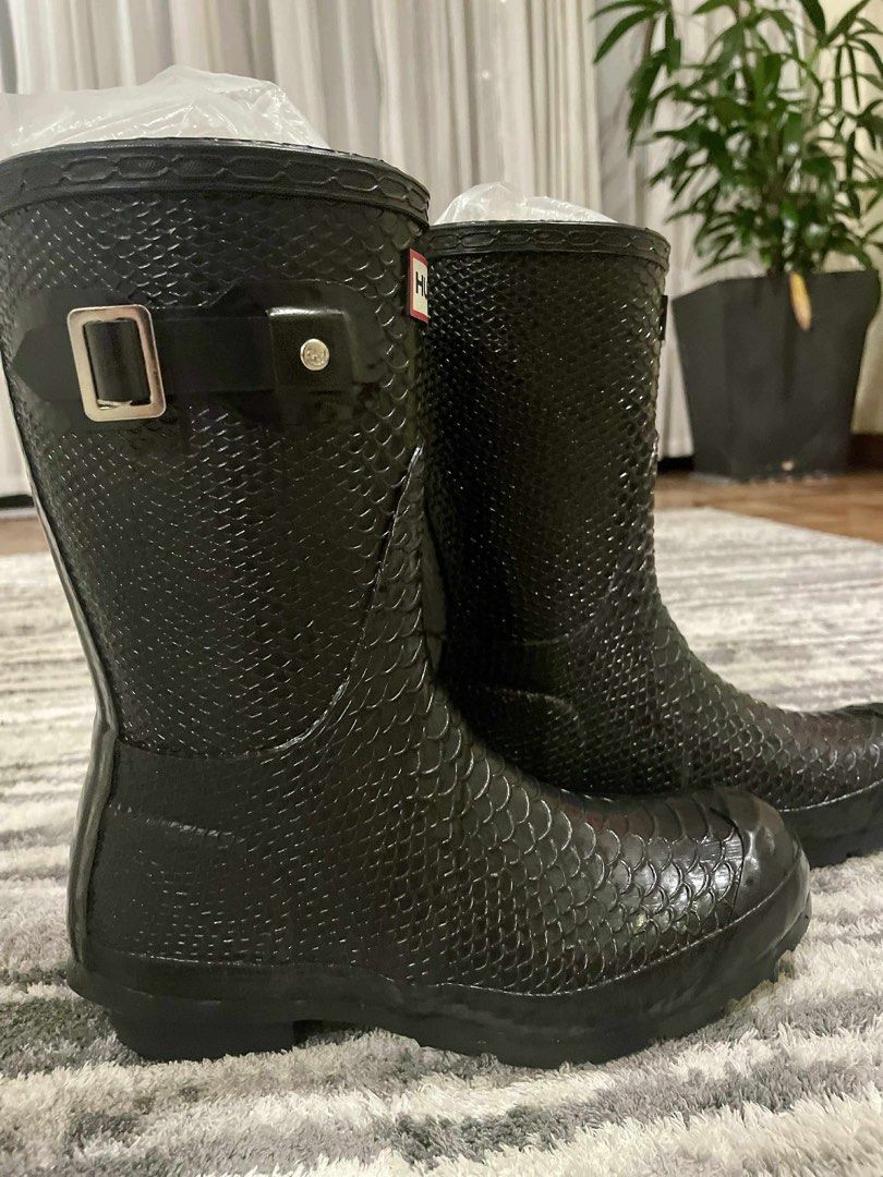 (HOLD) Hunter Carnaby Boa Snake Short Rain Boots (Category: Boots) located in Quezon City. Submitted by mymini.closet (Listing ID 1404027150, Image 3). Description: - Hunter rain boots - Black snake print - Short style - Buckle detail - Hunter logo - can fit size 6 to 7.5 with socks - no visible signs of wear.