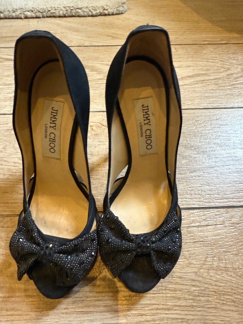 Jimmy Choo Black Heels with Bow Detail (Category: Heels) located in Taguig. Submitted by editroomph (Listing ID 1404000000, Image 1). Description: Jimmy Choo black heels Size 36 Elegant bow detail - Made in Italy - Stiletto heel Color: Black color Condition: Soles show wear 100% authentic Shipping c/o buyer Pick up Metro Manila.