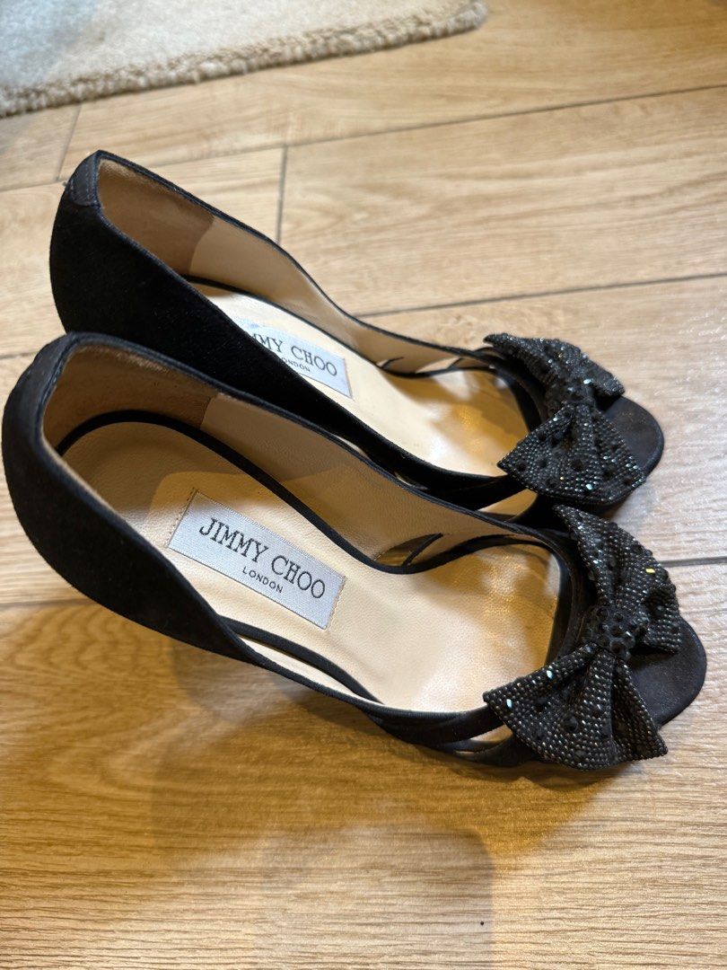 Jimmy Choo Black Heels with Bow Detail (Category: Heels) located in Taguig. Submitted by editroomph (Listing ID 1404000000, Image 2). Description: Jimmy Choo black heels Size 36 Elegant bow detail - Made in Italy - Stiletto heel Color: Black color Condition: Soles show wear 100% authentic Shipping c/o buyer Pick up Metro Manila.