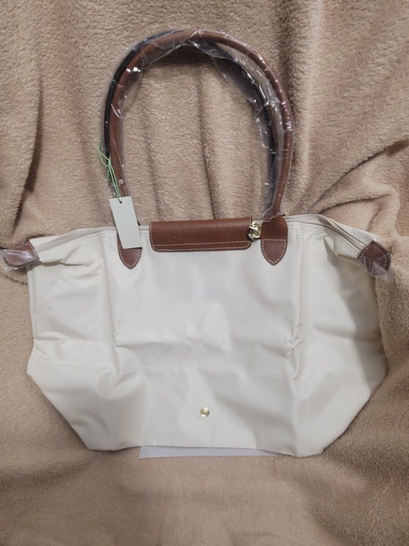 Longchamp Lepliage Large (Category: Luxury Bags & Wallets) located in San Pablo. Submitted by brandedandmore (Listing ID 1404160908, Image 3). Description: Brandnew Original Longchamp Lepliage Large Tote in White/Paper..