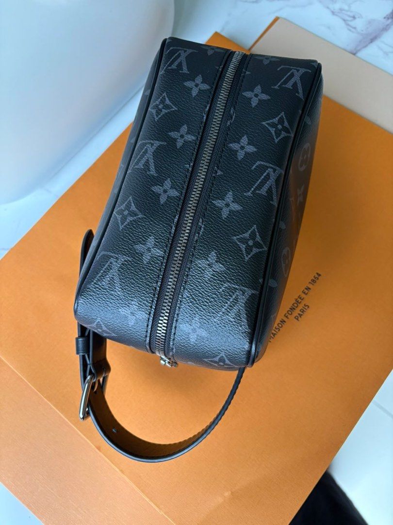 Louis Vuitton Monogram Eclipse Pouch (Category: Bags & Wallets) located in Kuala Lumpur. Submitted by fairuzalias (Listing ID 1403996439, Image 2). Description: - Louis Vuitton Monogram Eclipse Pouch - Features a secure zip closure - Includes a convenient wrist strap - Showcases the iconic Monogram Eclipse pattern - Comes with the original box - A stylish and practical everyday accessory.