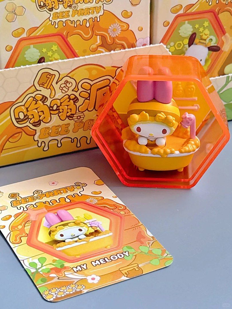 My Melody Bee Party Figurine (Category: Designer & Blind Box Toys) located in Caloocan City. Submitted by xmaplesyrup (Listing ID 1404138625, Image 1). Description: - My Melody Bee Party figurine! - Features My Melody in a bathtub. - Bee-themed design. - Includes a hexagonal display case. - Comes with a matching card. - Yellow and orange color scheme..